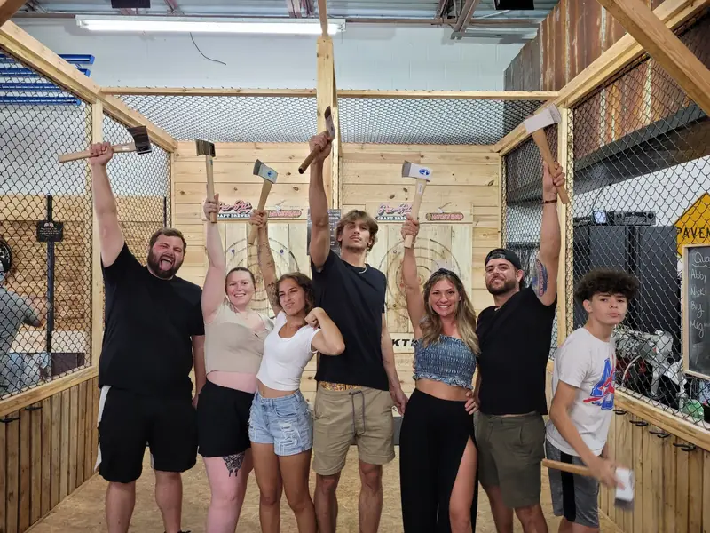 Friends throwing axes